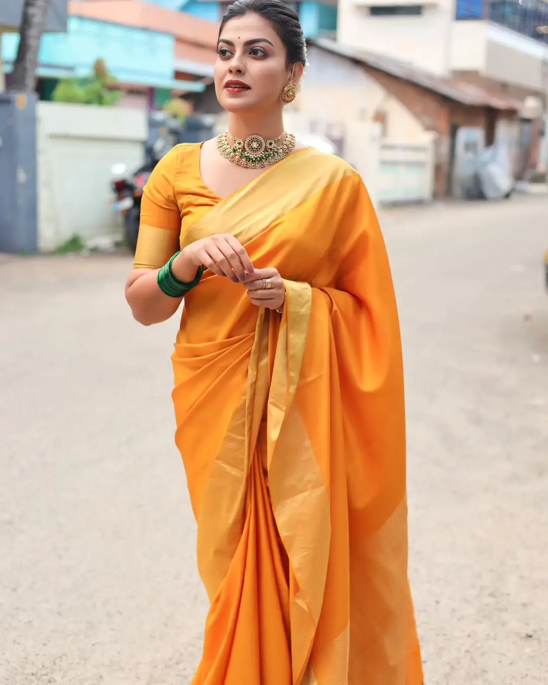 Anusree Nair Wearing Beautiful Earrings Jewellery Orange Saree Blouse